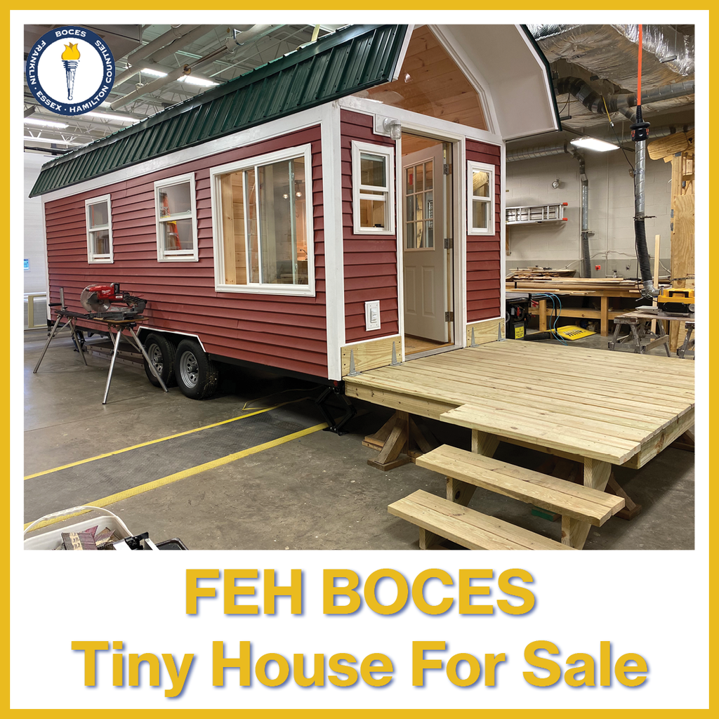 The words "tiny house for sale" with a photo of the tiny house
