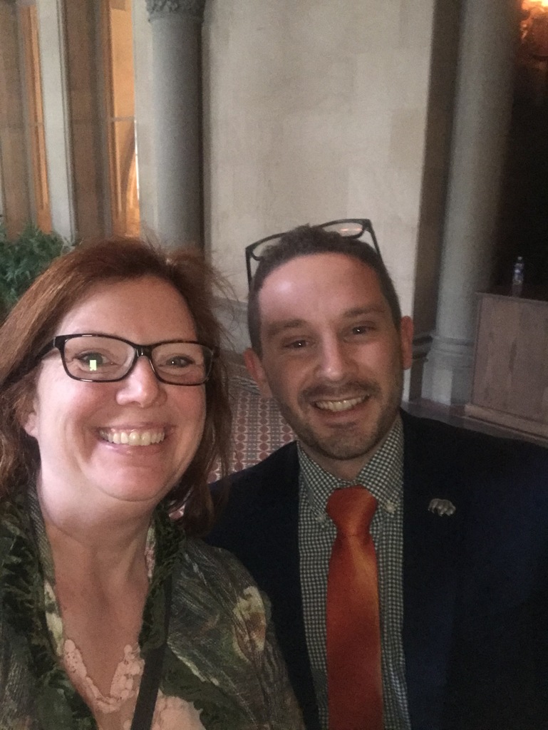 Tracy Edwards, New Vision Government & Law Teacher, and former student Nicholas Haas smile in the NY State Capitol Building.