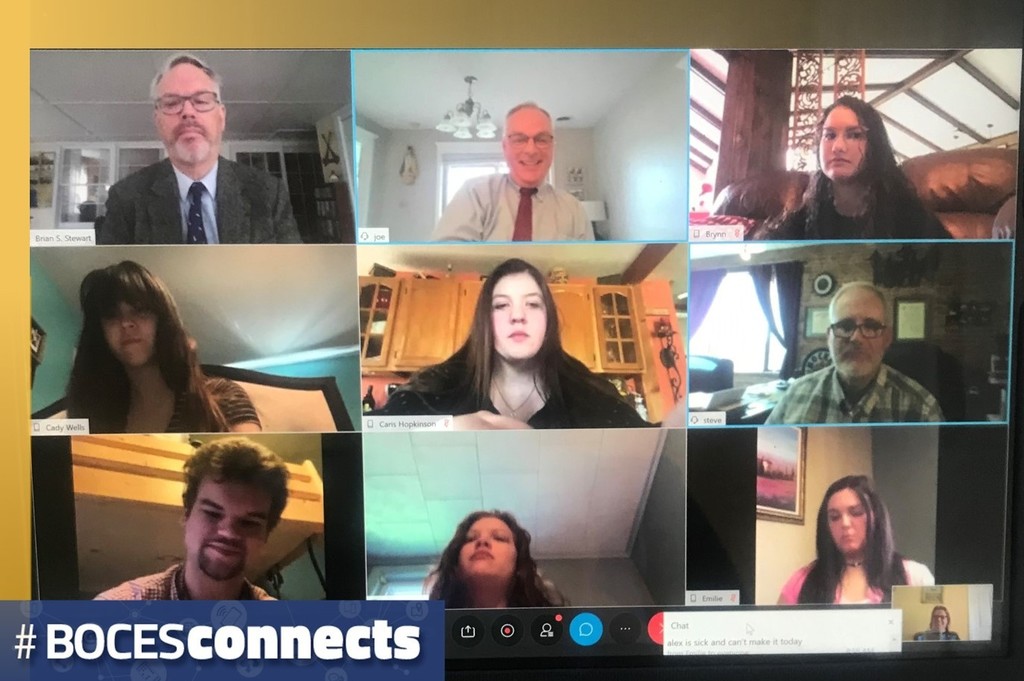 A videoconference screen with nine participants: three lawyers and six students