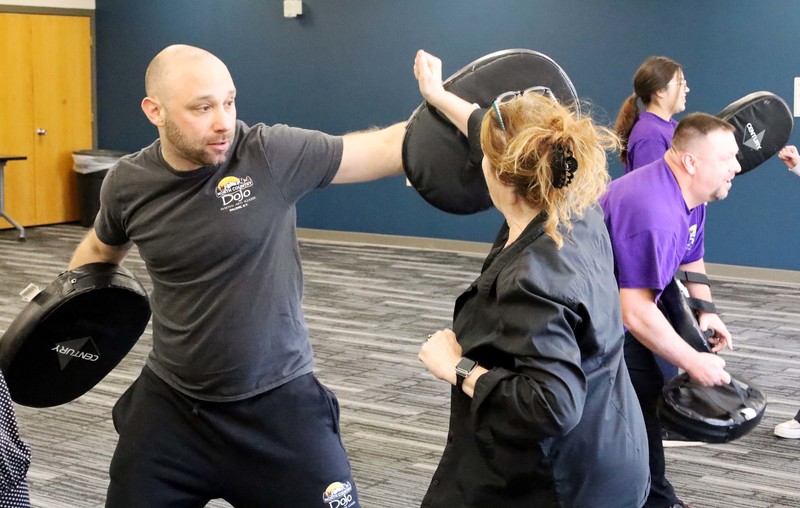 Early Childhood Education instructor Rhonda Shorette-Peets blocks an incoming strike from a North Country Dojo coach. 